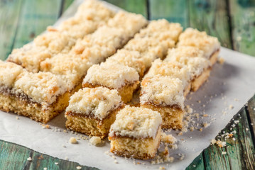 mini coconut cake with dulce de leche cut into squares ready to eat