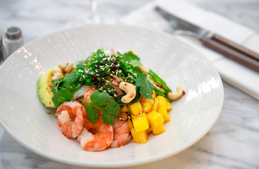 Fresh salad with shrimps.Vegetable salad. Fresh salad with vegetables and nuts. Vegetable salad on plate. Healthy vegetarian food
