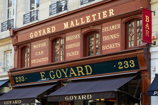 Goyard luxury shop with wooden facade and golden letters sign in summer on July 7, 2018 in Paris, France
