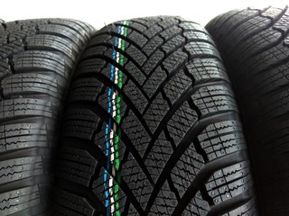 piles of different standard car tires - changing tires