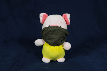 Pigs puppets with a protection mask on the mouth. Coronavirus style.