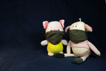 Pigs puppets with a protection mask on the mouth. Coronavirus style.