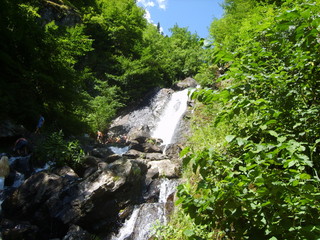 Fototapeta na wymiar Fantastic waterfall on a mountain river
