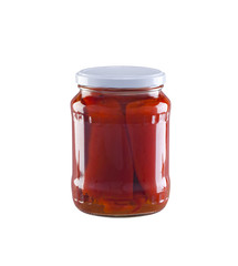 Canned, roasted, peeled pepper in a 700 ml glass jar isolated on a white background.