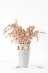 Beautiful pink Small flower tamarisk (Tamarix parviflora) in a vase on the table.
