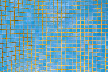 blue small tiles at a swimming pool as harmonic background