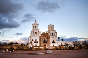 Exterior of Mission San Xavier del Bac against moody sky, Arizona