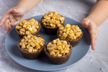 Apple charlotte cakes on blue plate on a grey table