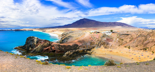 Fototapeta na wymiar Unique colorful beaches of volcanic Lanzarote. Papagayo beach. Canary islands