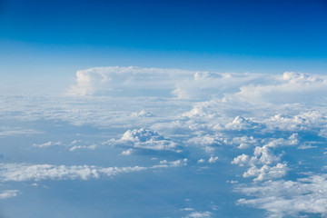 Fototapeta premium Clouds top view of the airplane. Heavenly landscape.