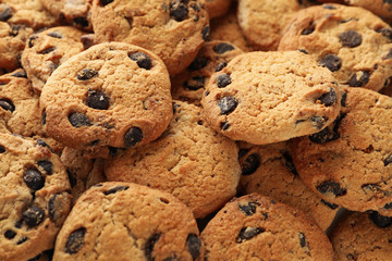 Chocolate chip cookies on whole background. Texture background