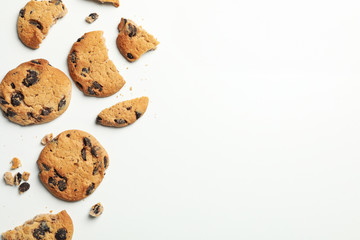 Tasty chocolate chip cookies on white background, top view
