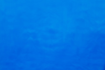 Blue background of water. Blured, unfocused