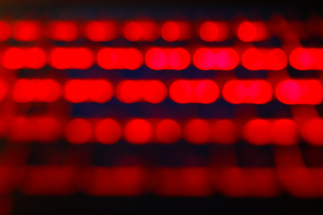 Unfocused blured red and black background bokeh. Blurred bright light