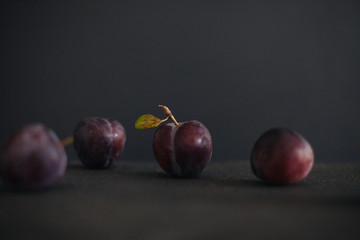 Organic plum on a dark background