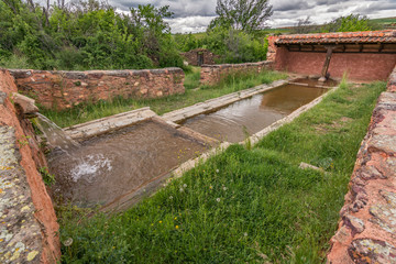 Restored old buddle well preserved in Madriguera red village in the province of Segovia (Spain)