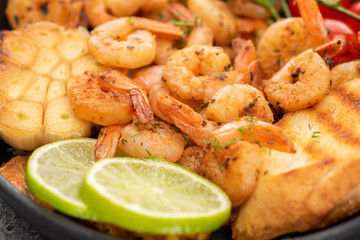 close up view of fried shrimps with lime