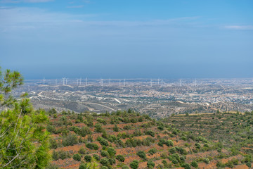 A wind farm is located along a picturesque valley.