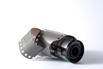 vintage 35mm Leica analogue  film rolls canister 136 color slide bulk loaded stock. Vintage Film's not dead isolated on white background simple minimalistic composition