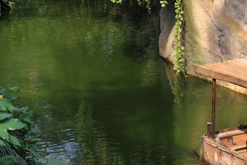 Boat shipping on river in zoo in Leipzig in germany.