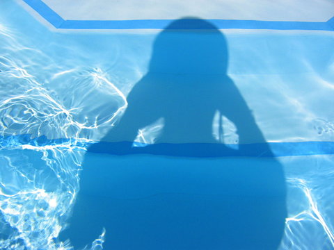 Shadow Of Person On Swimming Pool