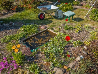 fragment of the garden during spring cleaning works on a sunny day