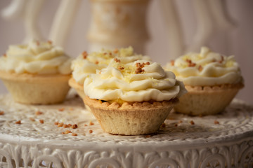 freshly baked and fluffy butter cream cupcakes with lemon juice taste
