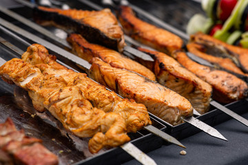 grilled meat and fish on skewers