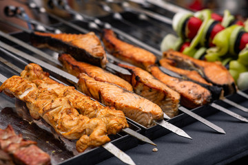grilled meat and fish on skewers
