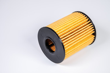 The filter element of a new oil filter. New spare parts for an internal combustion engine. Filter insert