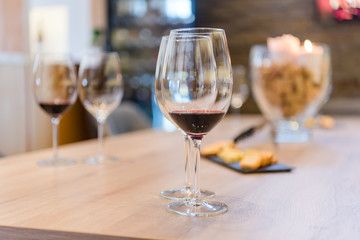 Close up on wine glasses in vineyard shop at tasting experience