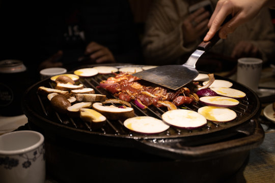 Street food cooking on griddle Beijing China