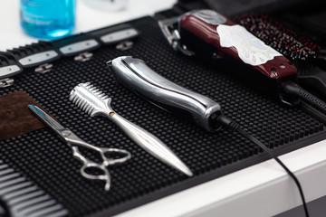 Fototapeta premium Barber tools on white background table with electric machines