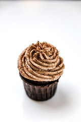 A delicious chocolate cupcake with cream