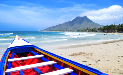 Colorful boats on one of the beautiful beaches of the Isla de Margarita, Venezuela.
