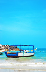 Fototapeta na wymiar Colorful boats on one of the beautiful beaches of the Isla de Margarita, Venezuela.