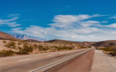 Landscape with a highway and mountains