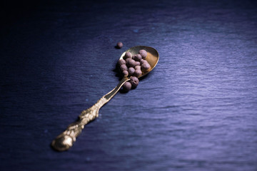 Vintage spoons and forks on a black background