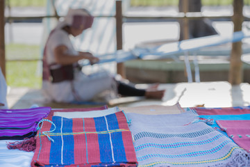 Home handicraft industrial work, Fabric product on woman weaving sari on loom background, handmade...