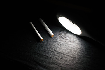 Cigarettes under the light of a lantern