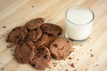 A few stacks of cookies and a glass of fresh milk.