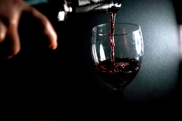 Pour red wine into a glass