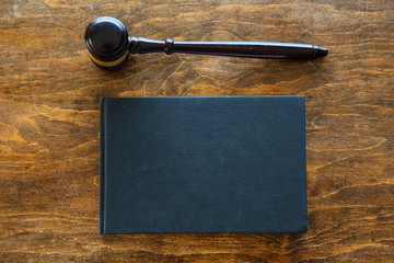 Judge auction gavel on wooden background, top view