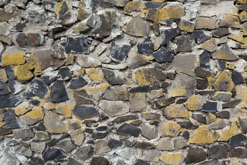 Texture of stone masonry on surface of wall