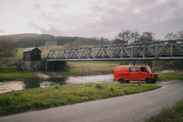 red firetruck under a bridge