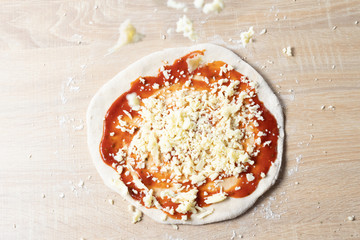 Pizza covered with Italian origin cheese, consisting of a generally round and flattened base of yeast wheat dough
