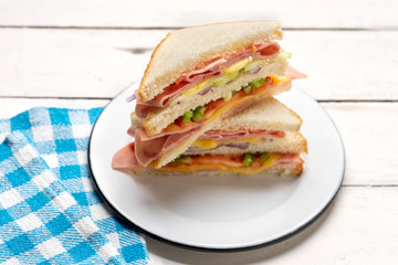 Ham sandwich with cheese on white background