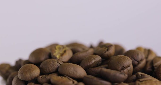 Beautiful black coffee beans. Fresh, roasted, fragrant, black, brown spinning on a sludge background. 3 shots