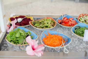 Close up of salad bar with assortment of ingredients