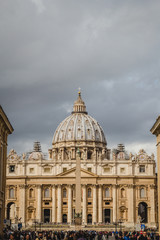 Fototapeta na wymiar Sculptures of Vatican City and St. Peter's Basilica dome